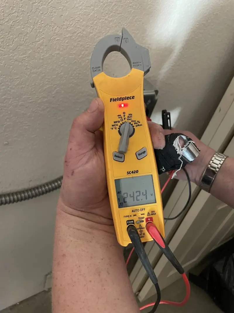 Voltage testing with clamp meter during Outlet Installation in New Ulm